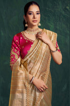 Champagne golden party wear saree, front view showing the satin silk blouse and pleated drape