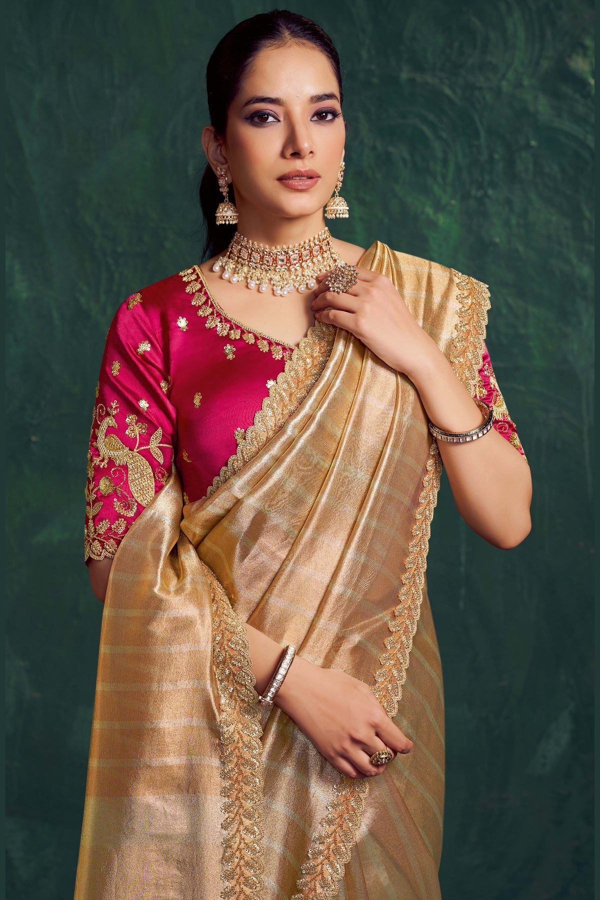 Champagne golden party wear saree, front view showing the satin silk blouse and pleated drape