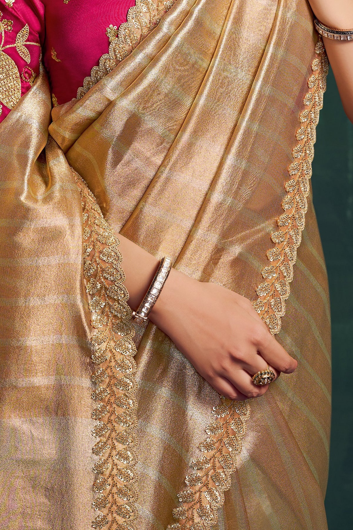 Champagne golden sequin saree, waist-down view of the pleats and shimmering drape