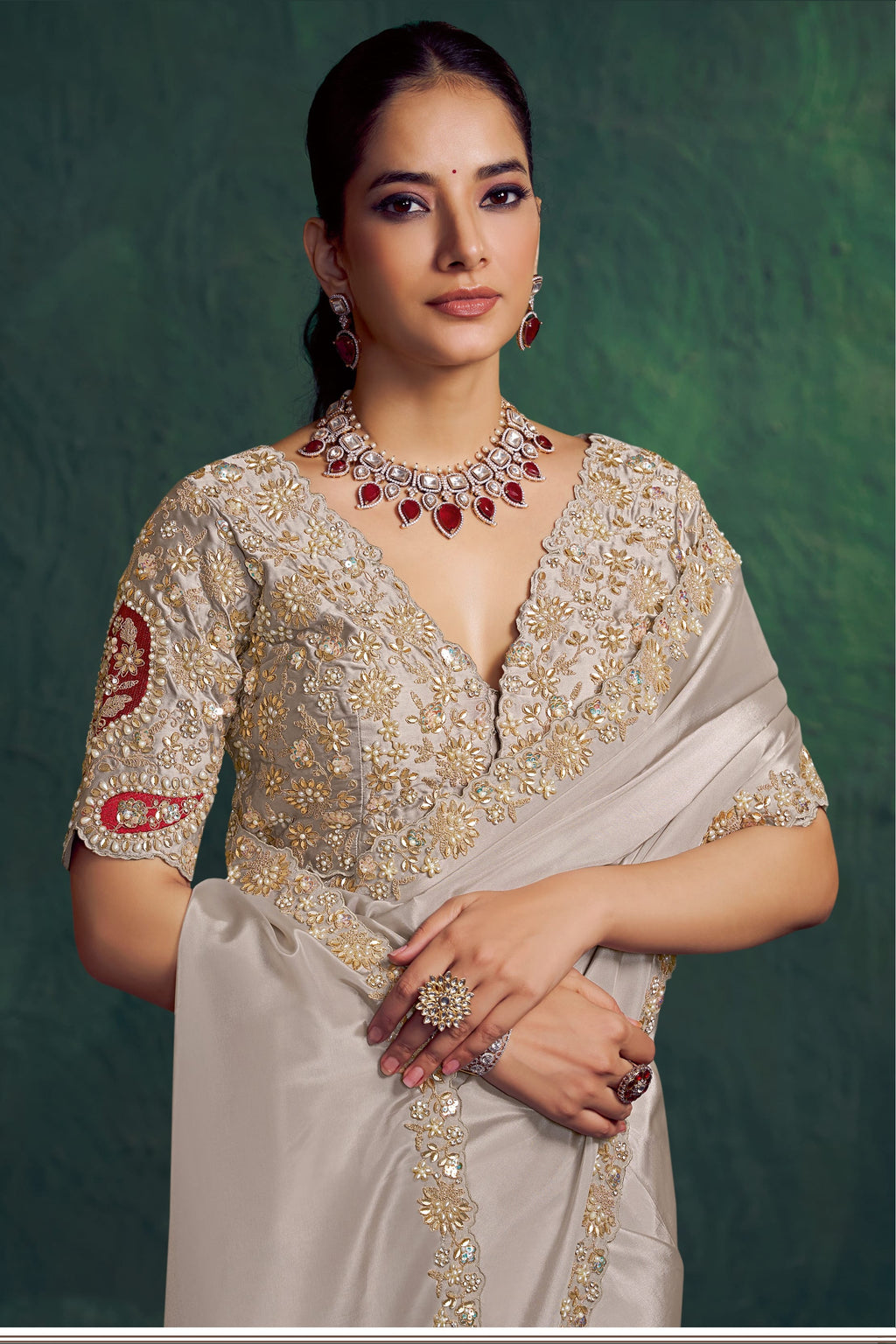 Off white embroidered saree, front view showing the embellished satin silk blouse and uppada silk drape