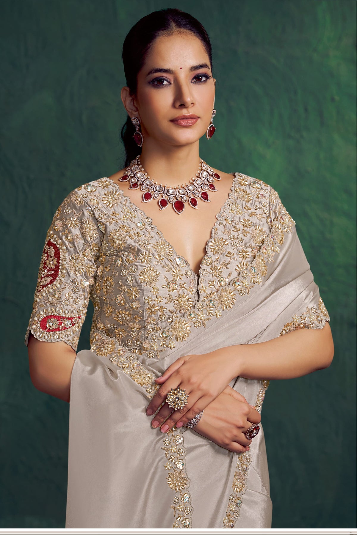Off white embroidered saree, front view showing the embellished satin silk blouse and uppada silk drape