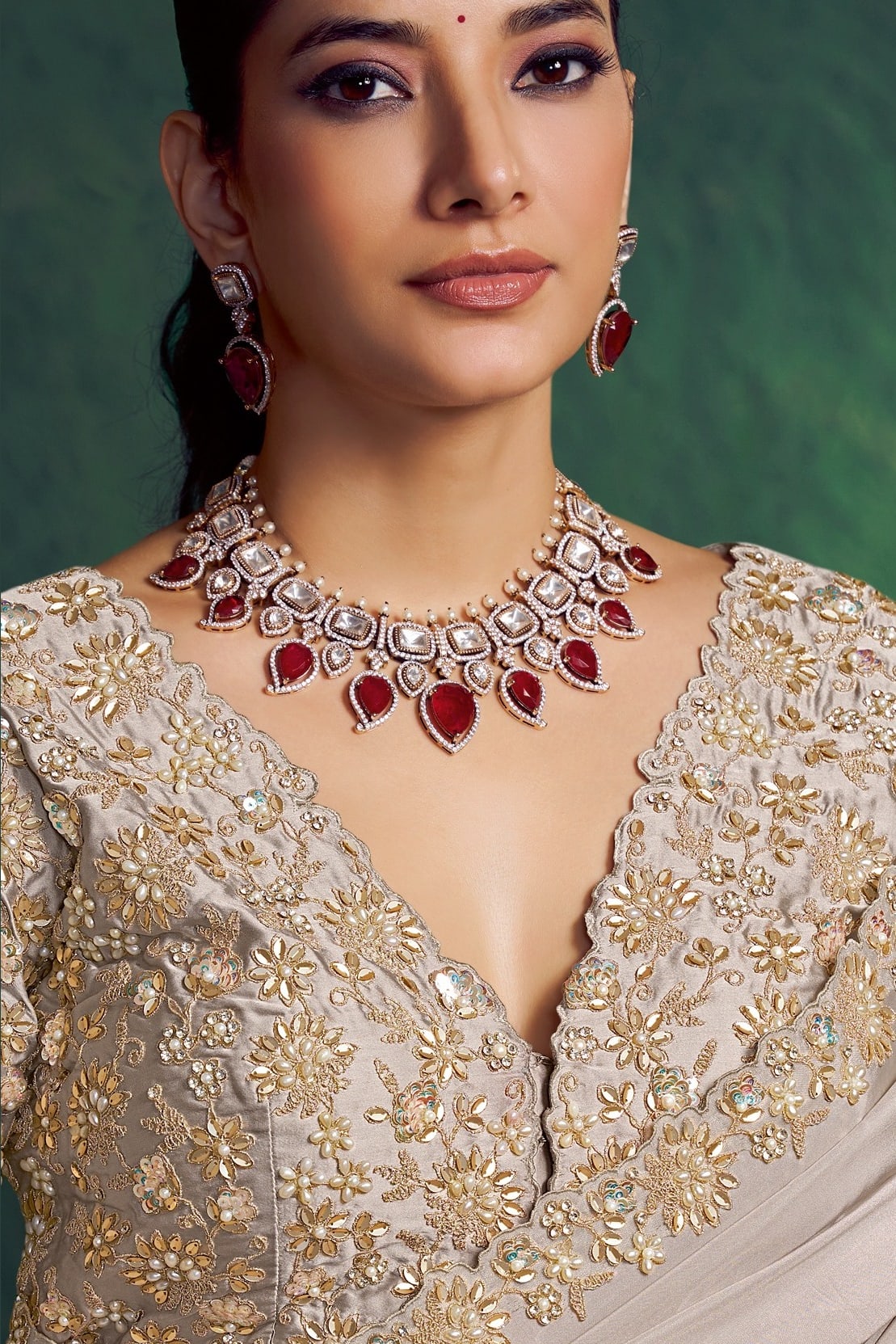 Off white designer saree, upper-body closeup of the sequin embroidery and stone work detail