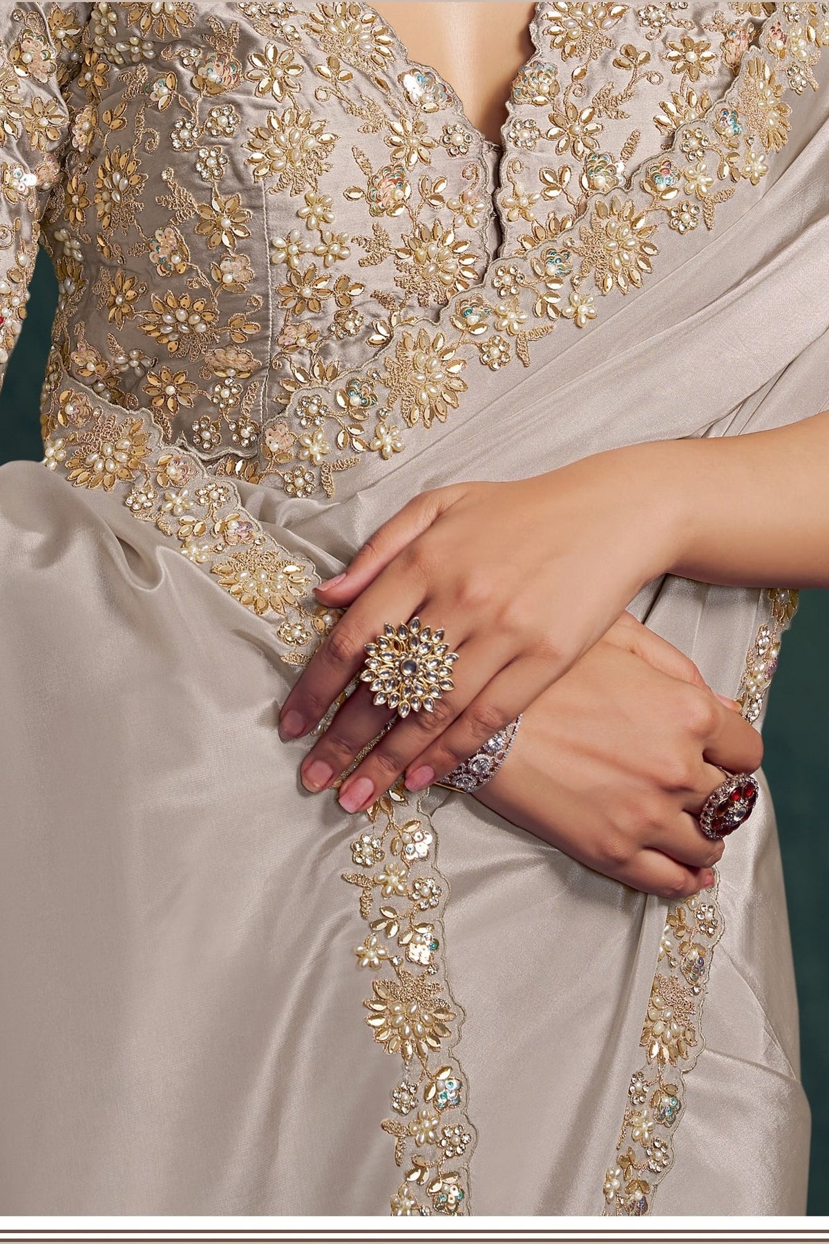 Off white sequin saree, waist-down view of the pleats and shimmering drape