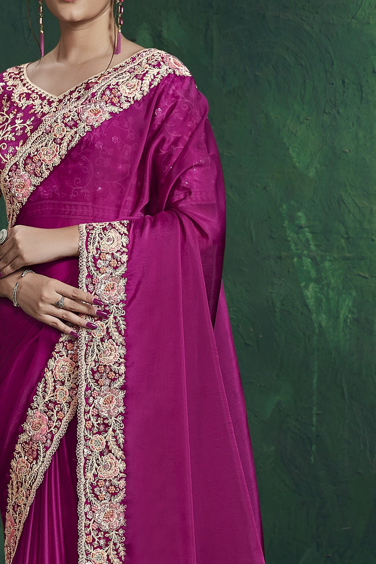 Magenta party wear saree, front view showing the pure silk blouse and shimmering drape