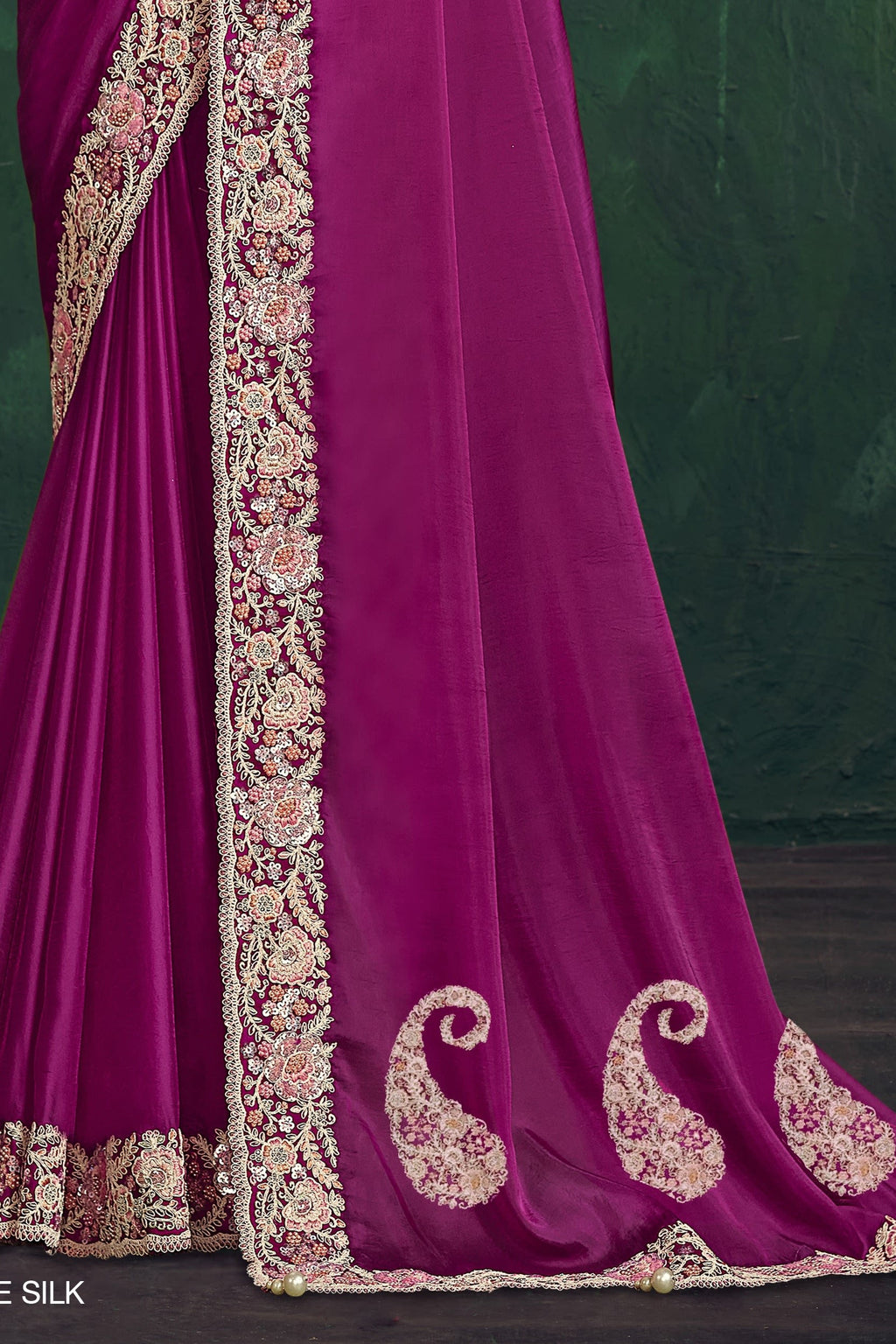 Magenta embroidered saree, waist-down view of the pleats and shimmering drape