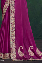 Magenta embroidered saree, waist-down view of the pleats and shimmering drape