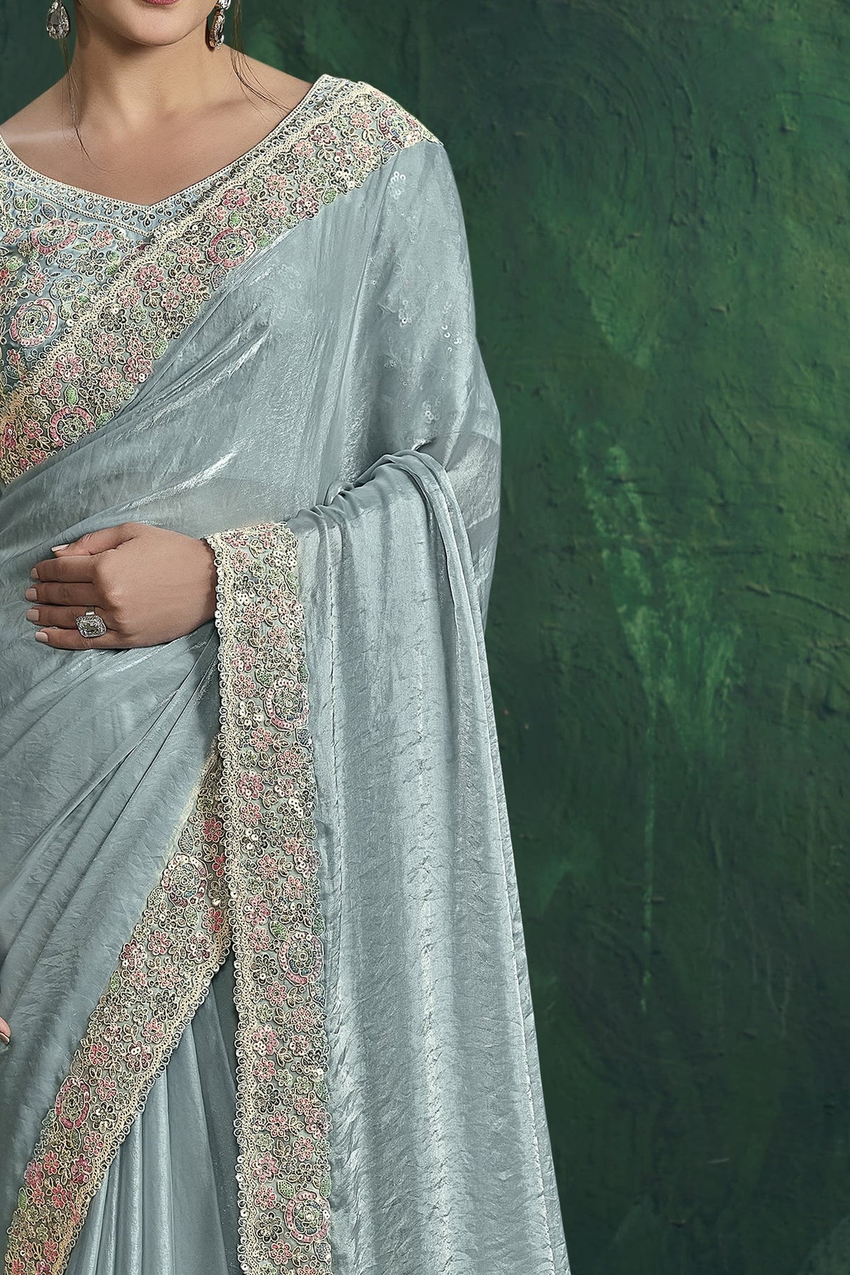 Pastel blue embroidered saree, front view showing the embellished satin silk blouse and drape
