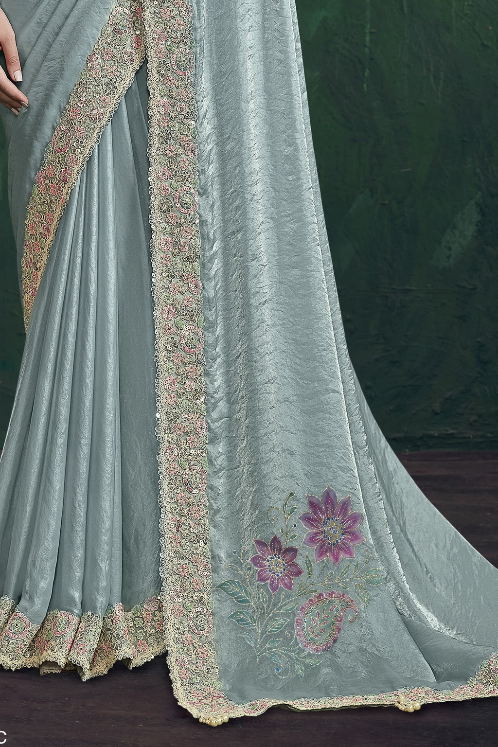 Pastel blue designer saree, waist-down view of the pleats and shimmering drape