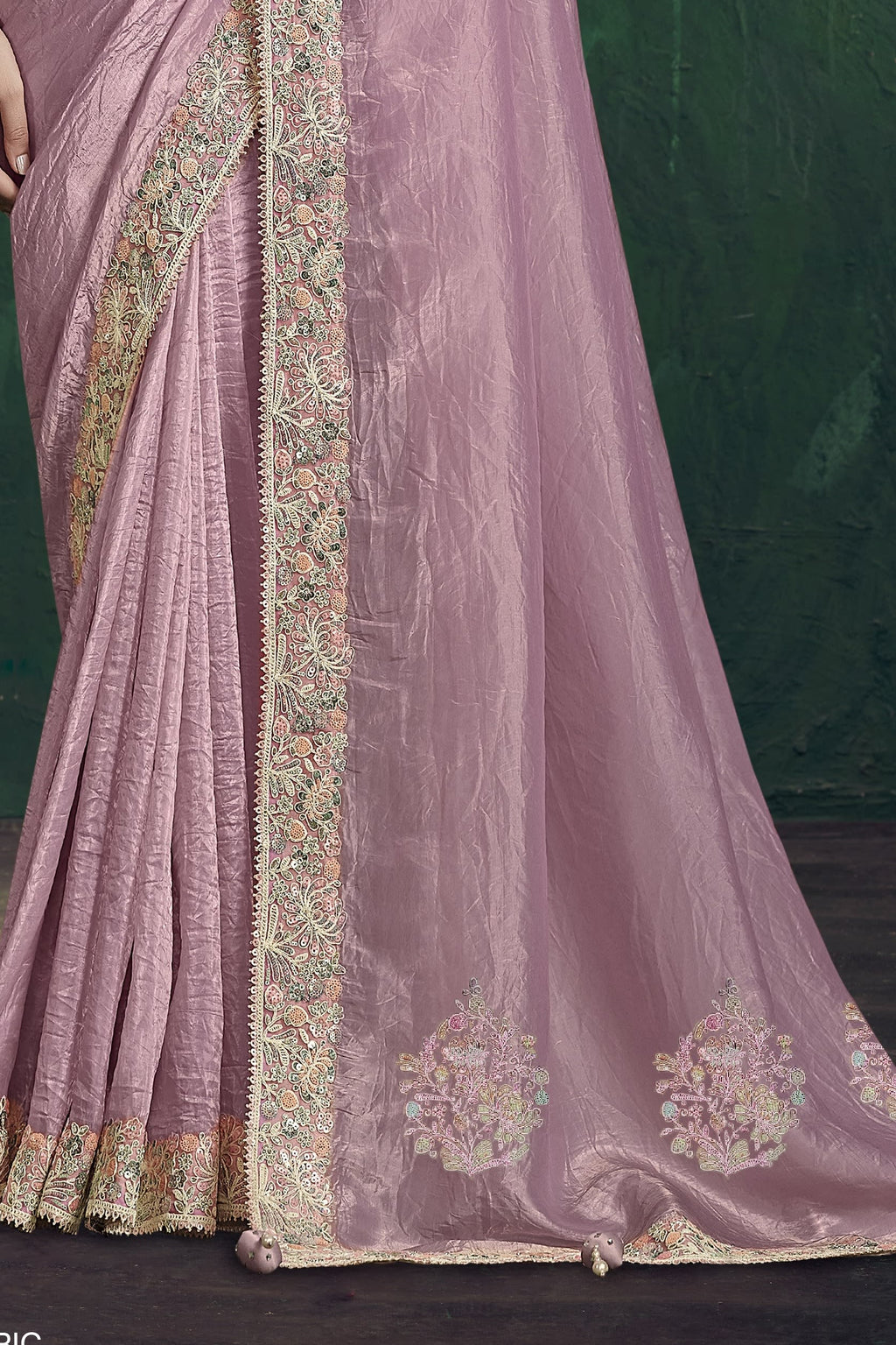Baby pink saree for wedding, waist-down view of the pleats and shimmering drape