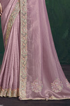 Baby pink saree for wedding, waist-down view of the pleats and shimmering drape