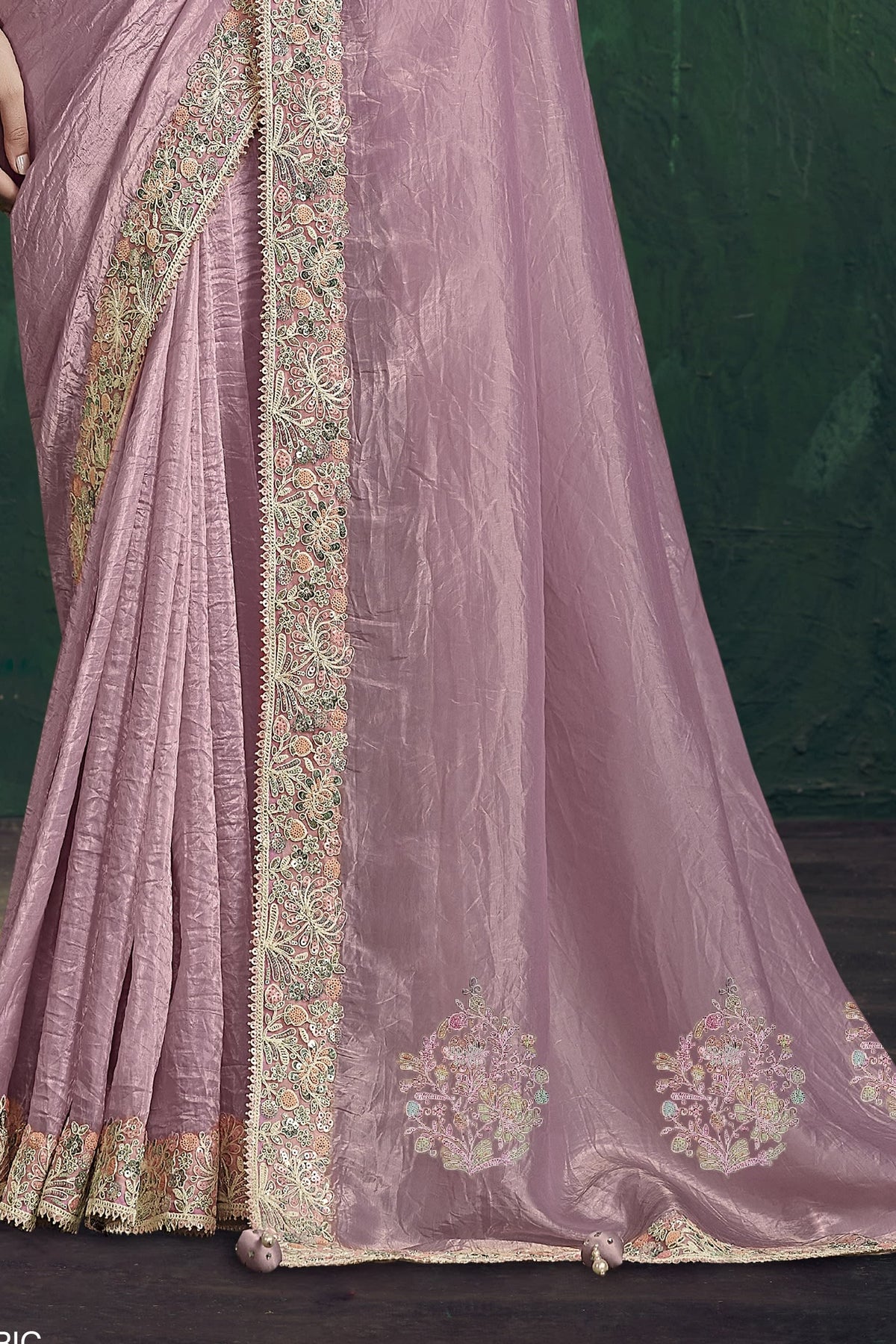 Baby pink saree for wedding, waist-down view of the pleats and shimmering drape