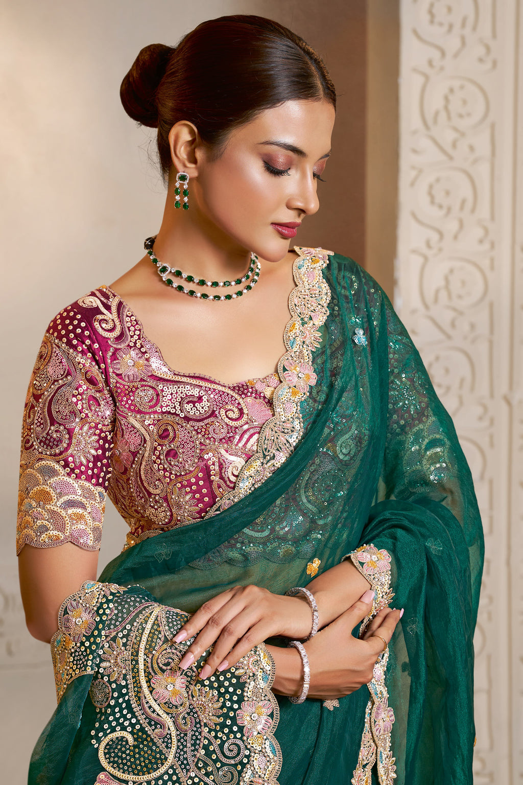 Emerald Green embroidered saree with thread embroidery and stone handwork, front view showing the embellished blouse and detailed border