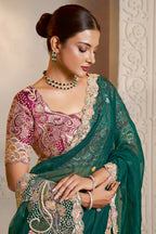 Emerald Green embroidered saree with thread embroidery and stone handwork, front view showing the embellished blouse and detailed border