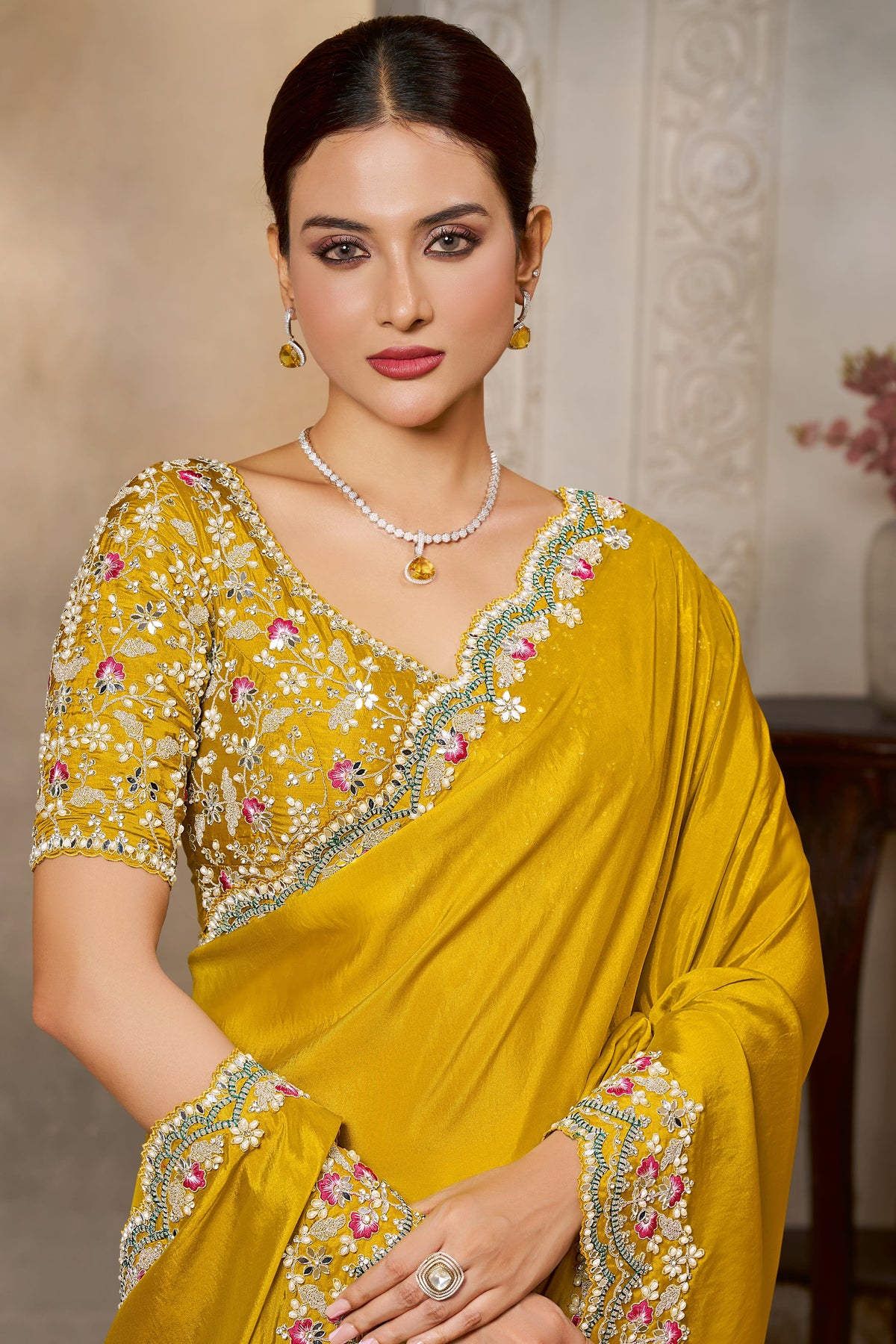 Mustard Yellow sequin saree with sequin and stone handwork, waist-down view of the pleats and flowing saree drape