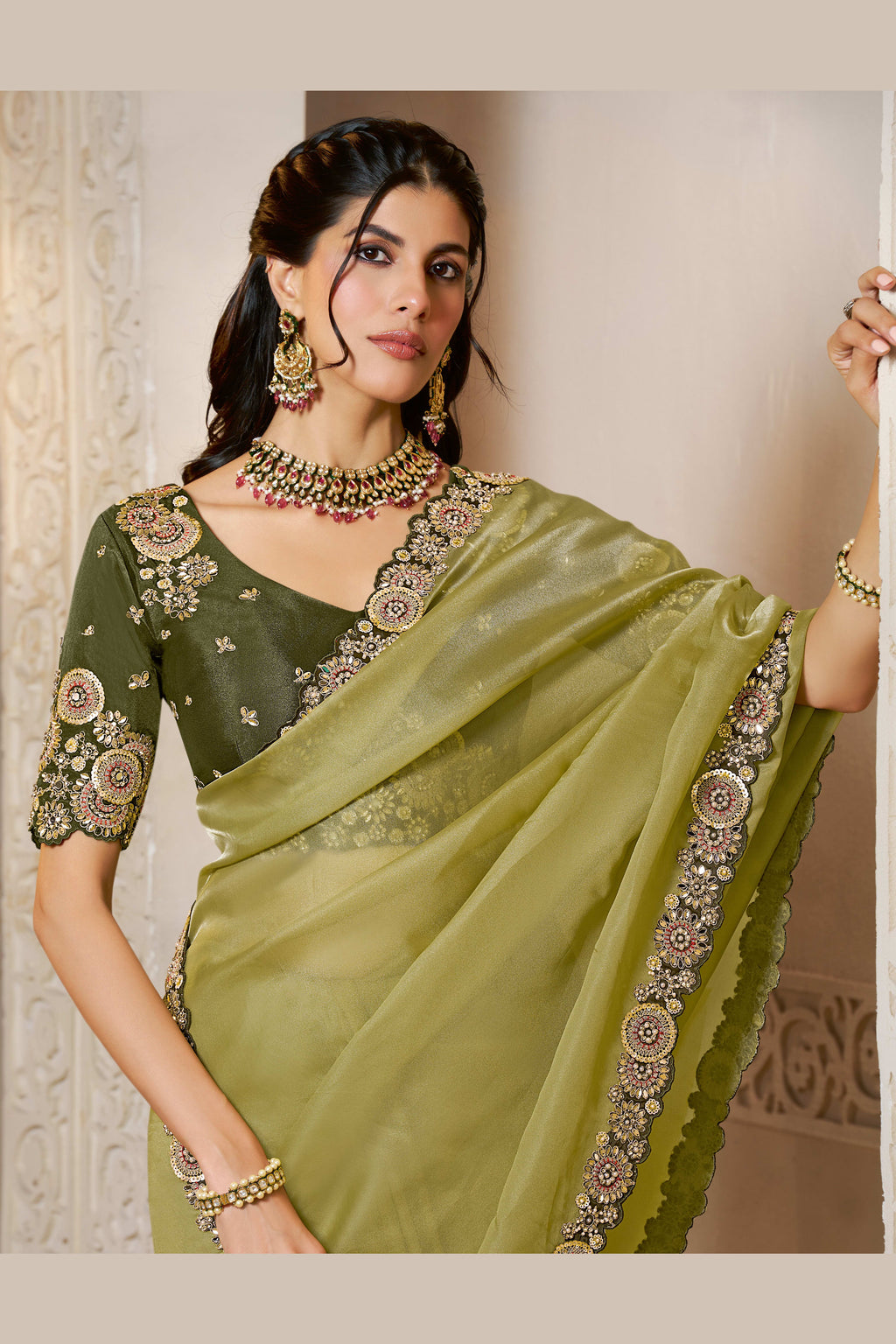 Olive Green sequin saree with sequin and stone handwork, front view showing the embellished blouse and detailed border