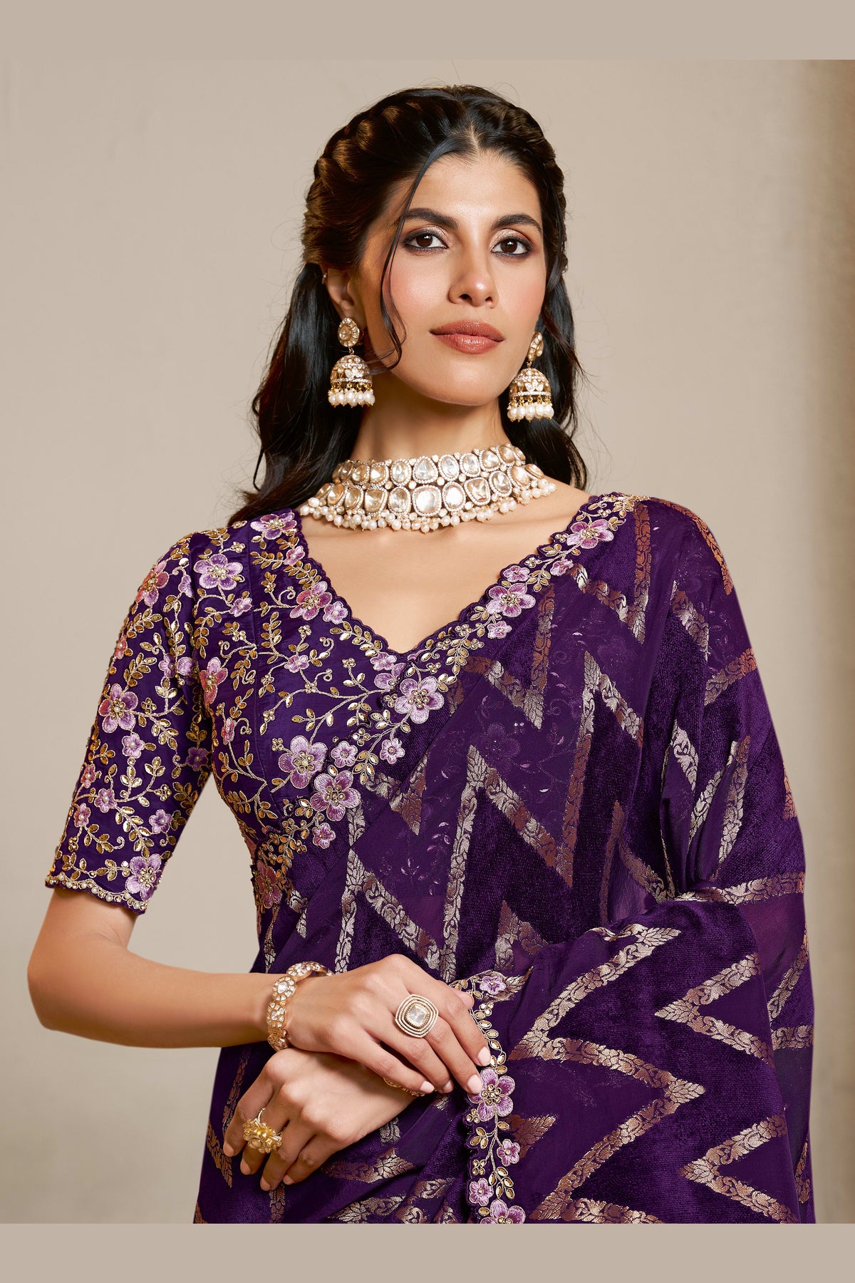 Purple embroidered saree with thread embroidery and stone handwork, front view showing the embellished blouse and detailed border