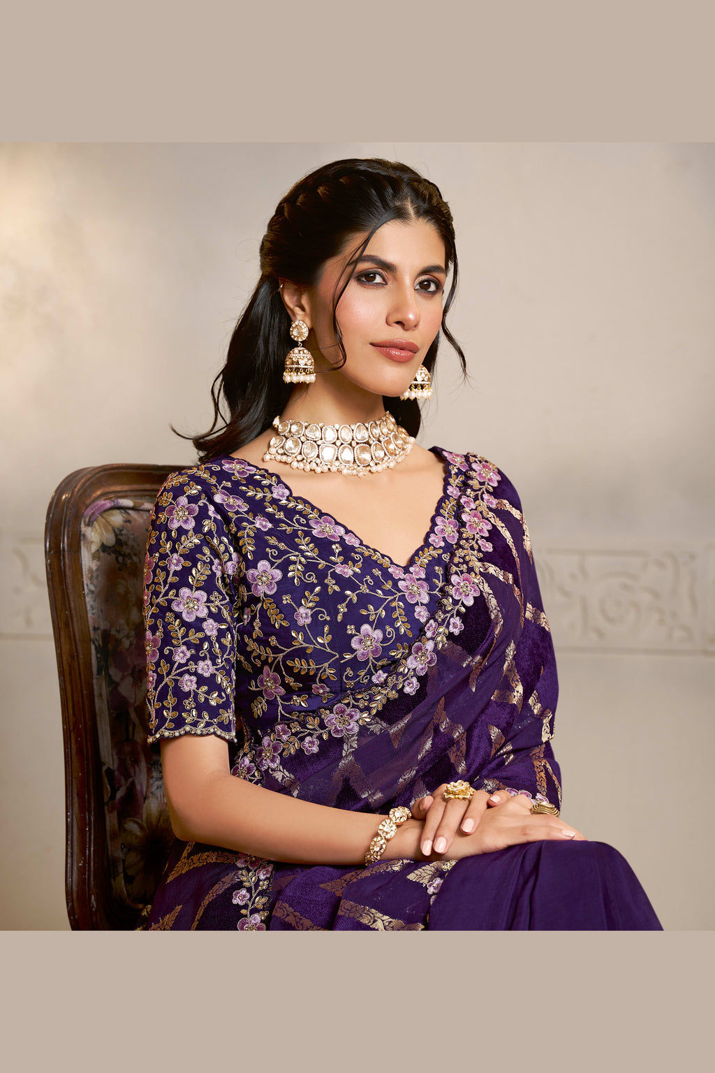 Purple embroidered saree with thread embroidery and stone handwork, waist-down view of the pleats and flowing saree drape