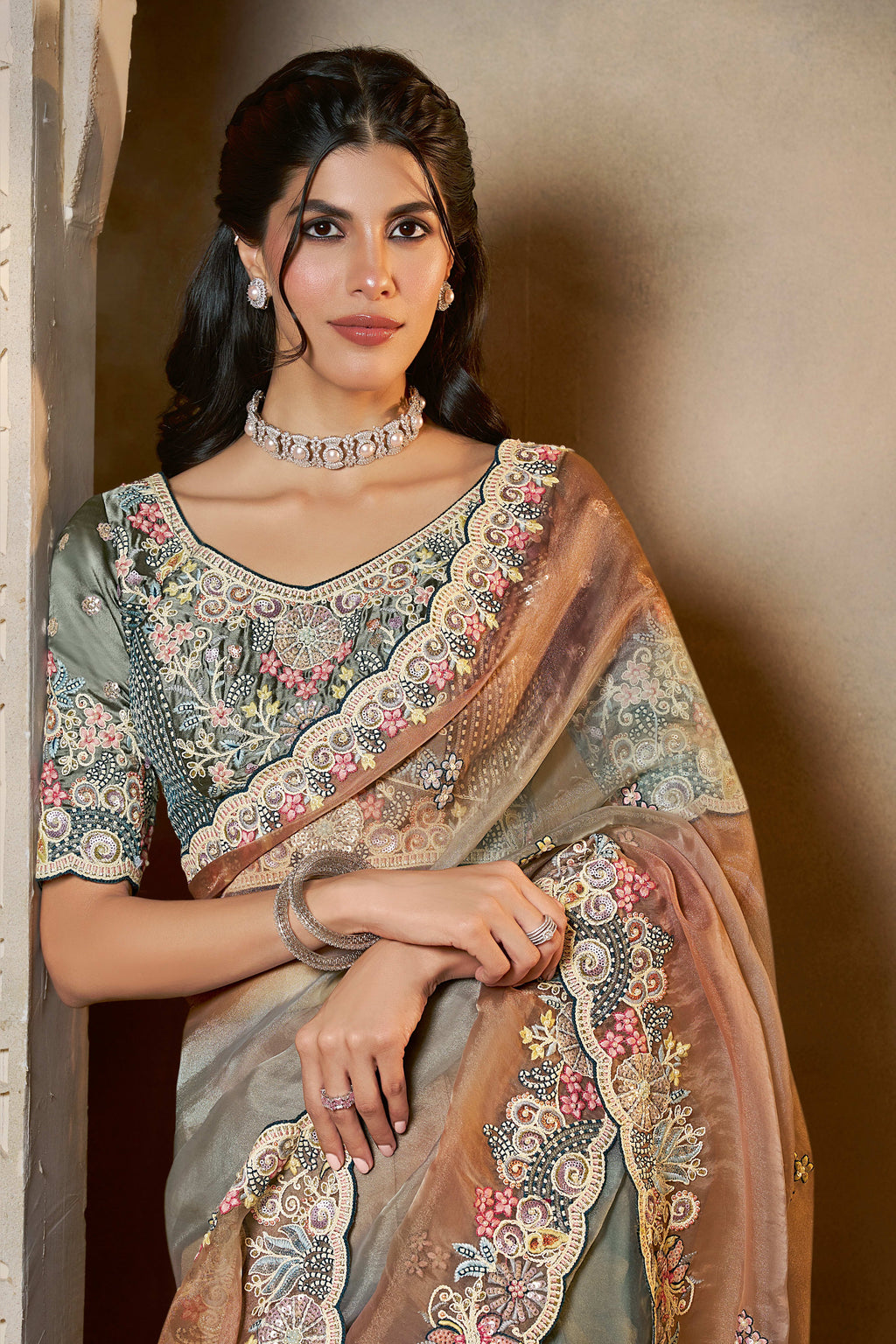 Dusty Blue organza saree with stone and thread handwork, front view showing the embellished blouse and detailed border