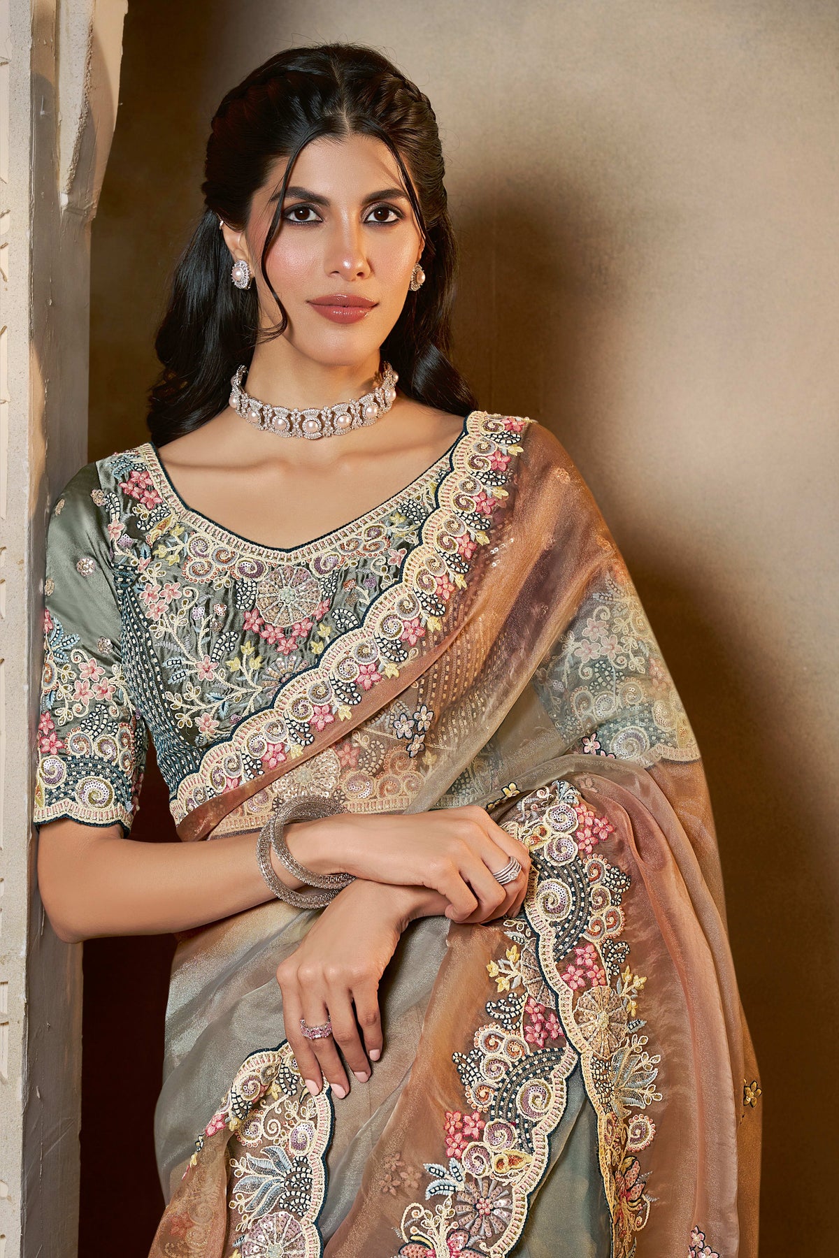 Dusty Blue organza saree with stone and thread handwork, front view showing the embellished blouse and detailed border