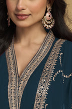 Torso detail view of a dark teal silk salwar kameez style kurta in georgette with thread and sequin embroidery and dupatta.