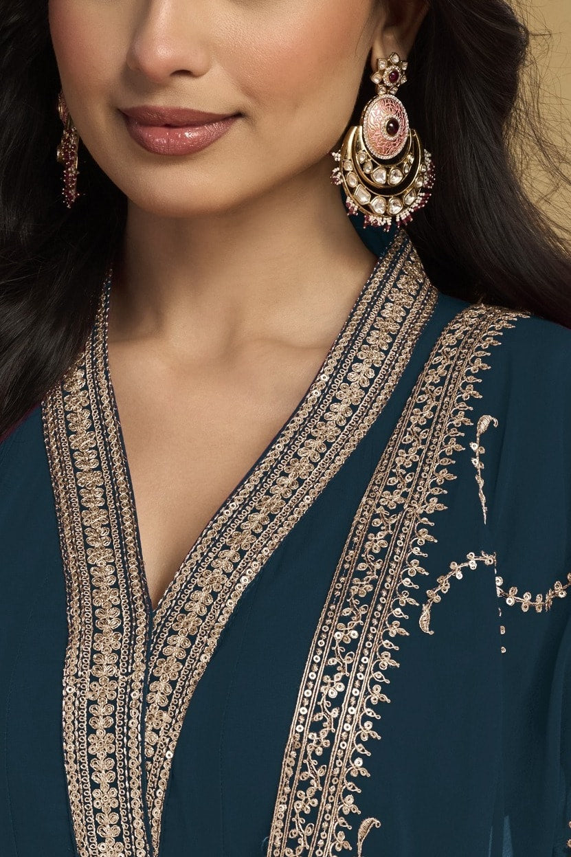 Torso detail view of a dark teal silk salwar kameez style kurta in georgette with thread and sequin embroidery and dupatta.