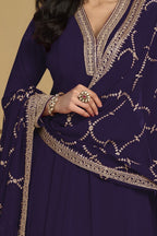 Torso detail view of a dark purple indian salwar kameez in georgette with thread and sequin embroidery on the kurta and dupatta.