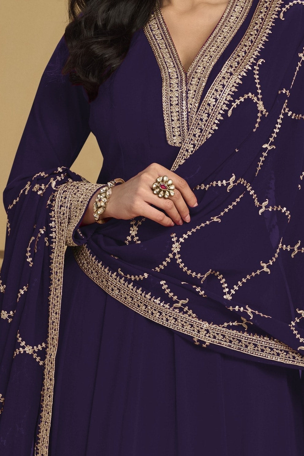 Torso detail view of a dark purple indian salwar kameez in georgette with thread and sequin embroidery on the kurta and dupatta.