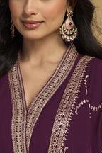 Torso detail view of a plum salwar suit in georgette with thread and sequin embroidery on the kurta bodice and dupatta border.