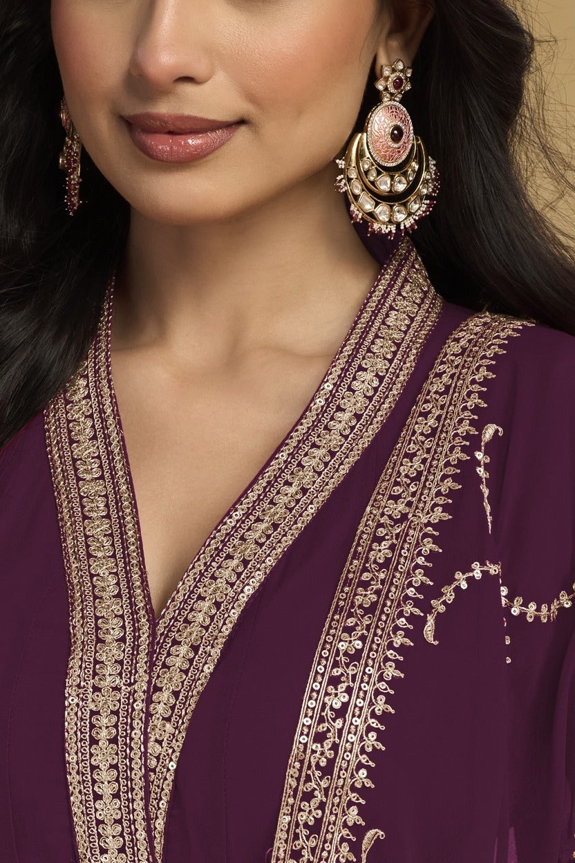 Torso detail view of a plum salwar suit in georgette with thread and sequin embroidery on the kurta bodice and dupatta border.