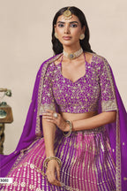 Close-up of a purple engagement lehenga blouse in georgette with zari and sequin work on the V neckline and elbow sleeves.