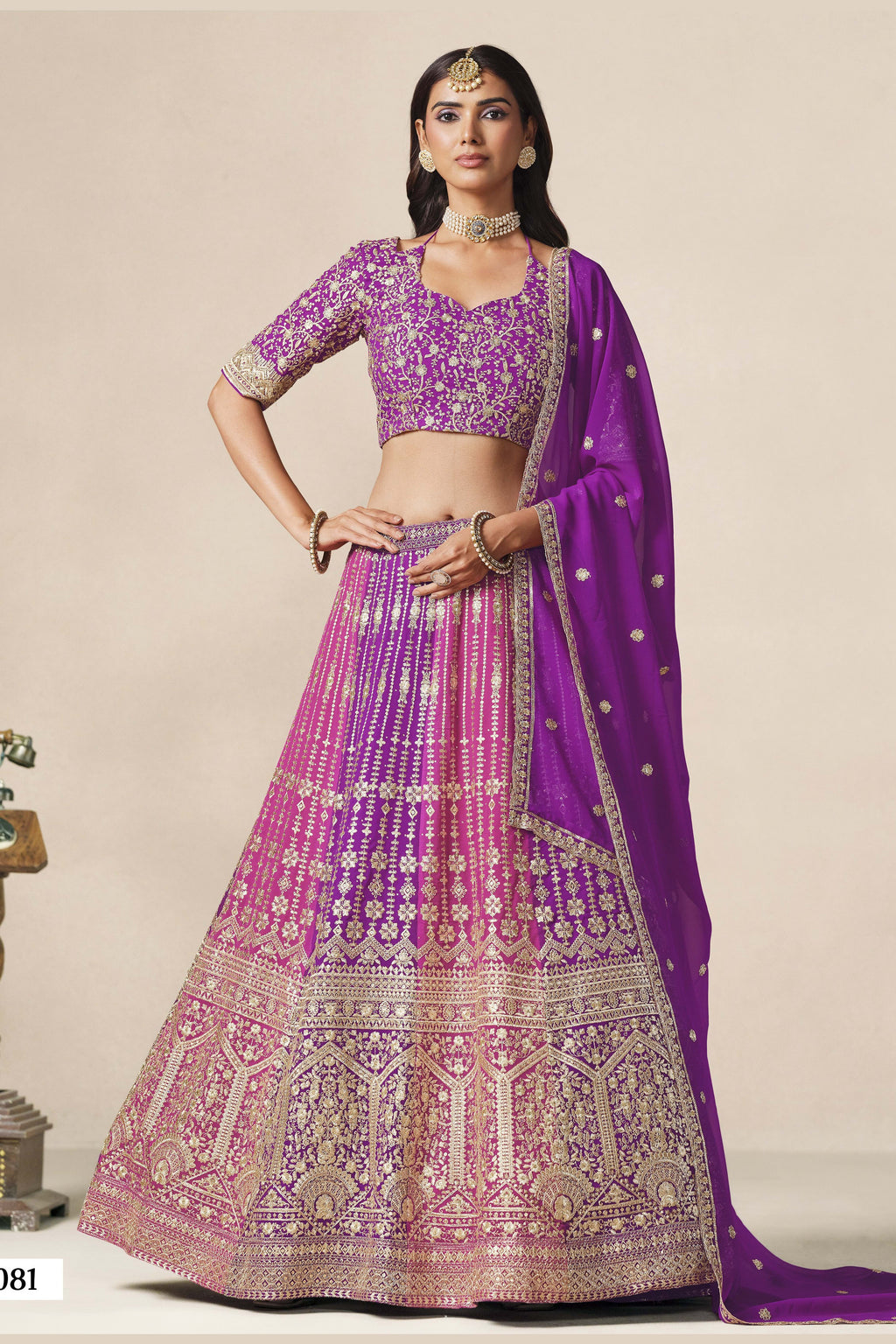 Full-length front view of a purple festive wear for women lehenga in georgette with zari and sequin work and a flowing embroidered dupatta.