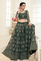 Close-up of codding and badla embroidery work on mahendi net lehenga choli