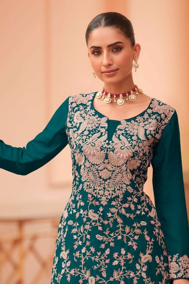 Torso detail view of a teal palazzo dress in chinon silk with thread embroidery work on the kameez neckline, bodice and dupatta.