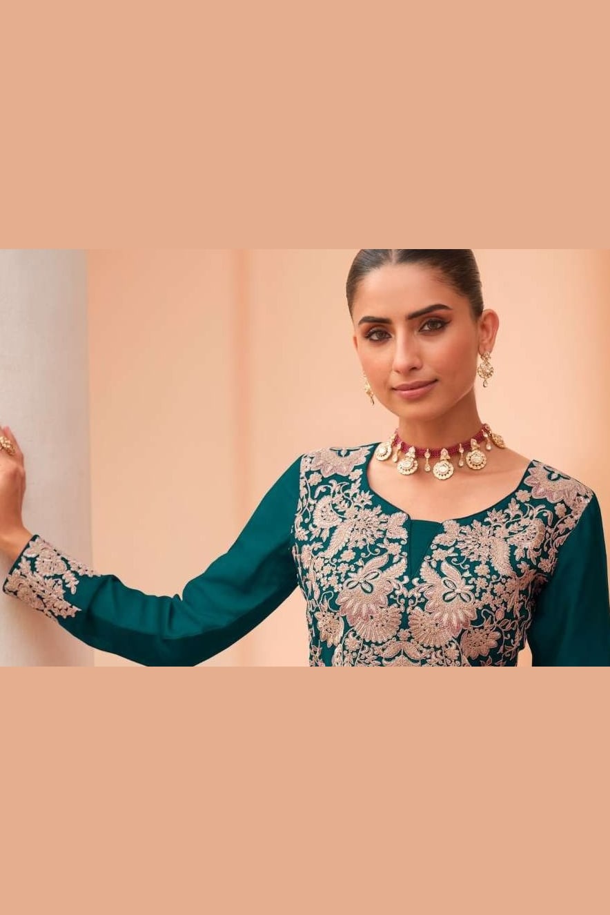 Close-up of the neckline embroidery on a teal plazo dress in chinon silk with delicate thread embroidery work on the bodice.