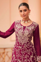 Torso detail view of a maroon palazzo suit in chinon silk with thread embroidery work on the kameez neckline, bodice and dupatta.