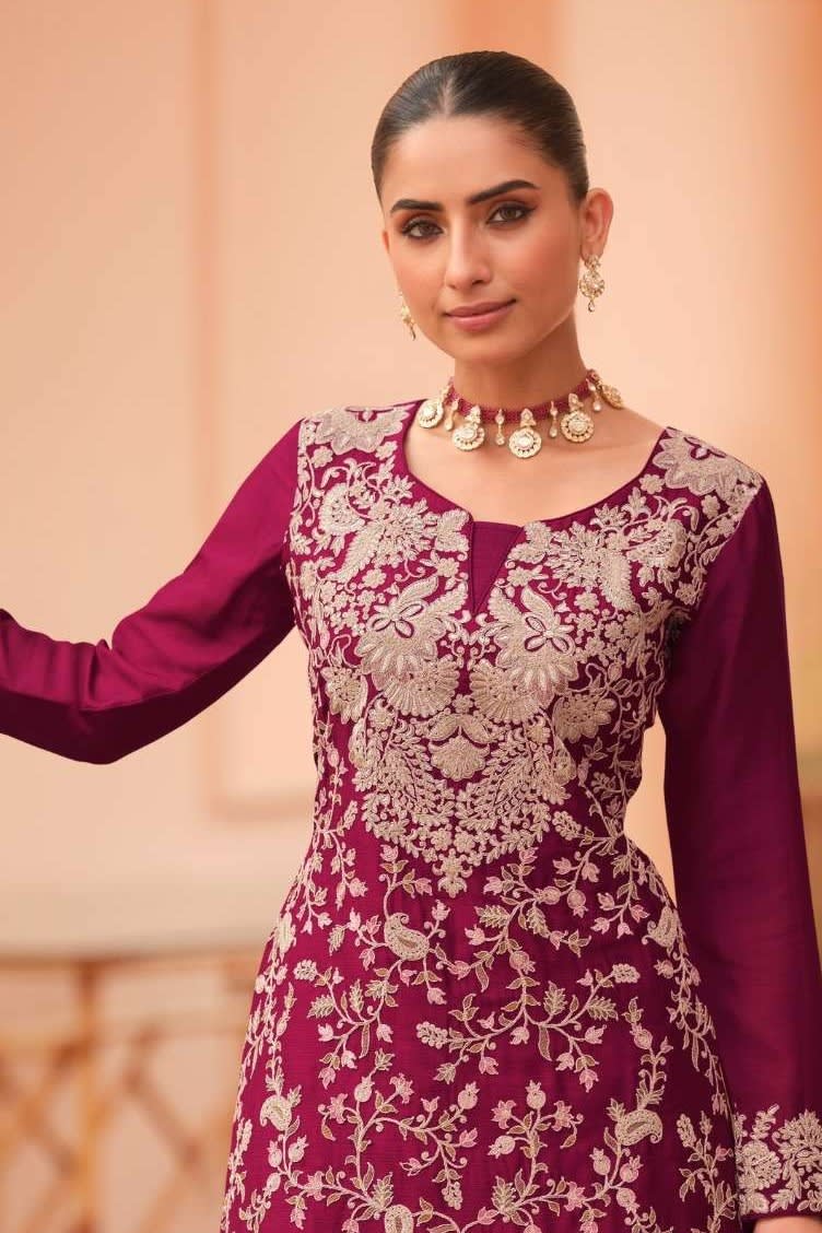Torso detail view of a maroon palazzo suit in chinon silk with thread embroidery work on the kameez neckline, bodice and dupatta.