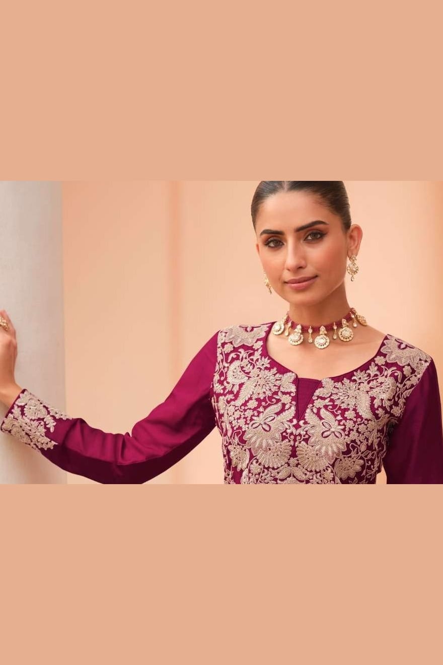 Close-up of the neckline embroidery on a maroon party wear palazzo suit in chinon silk with thread embroidery work on the bodice.