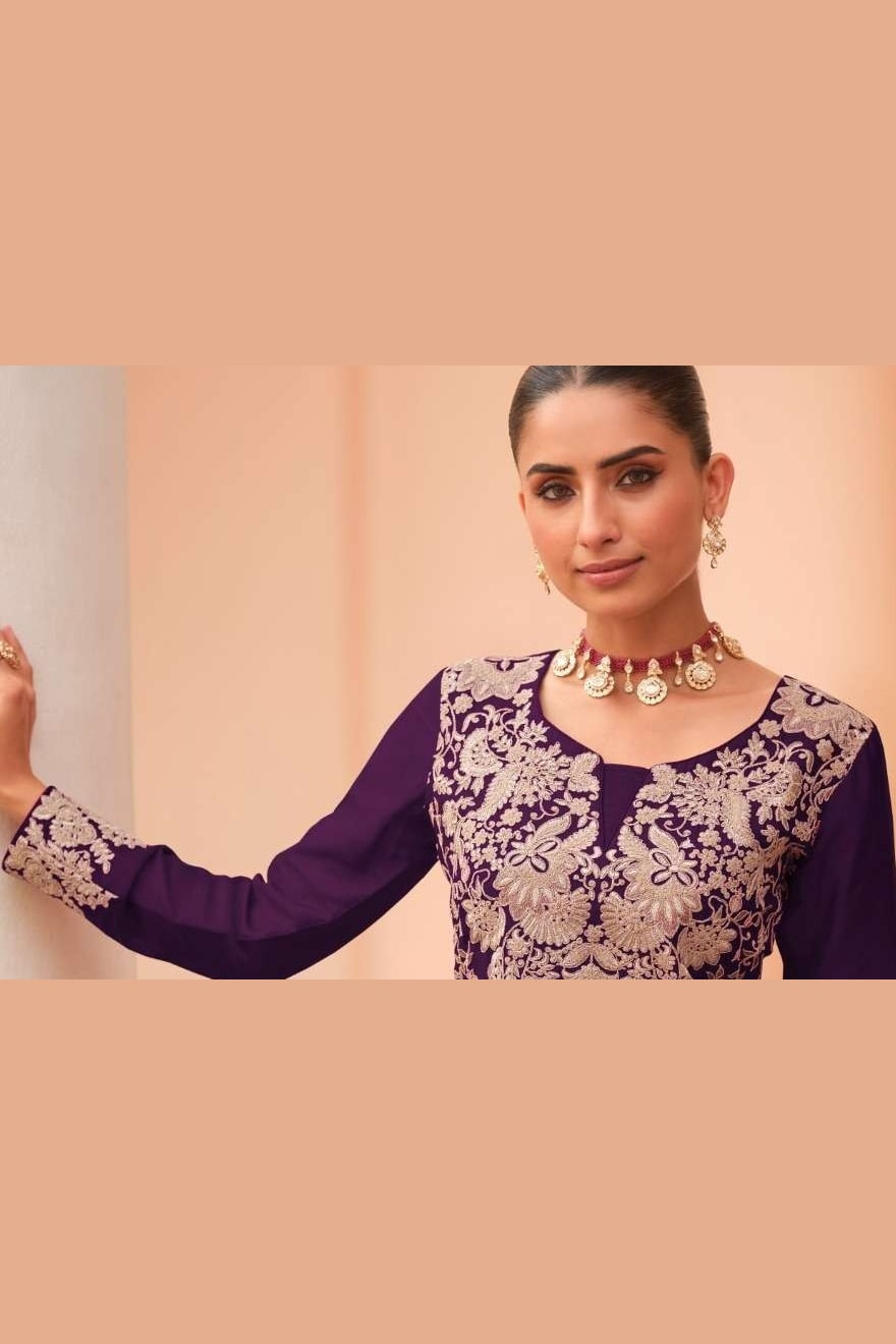 Close-up of the neckline embroidery on a dark purple plazo dress in chinon silk with thread embroidery work on the bodice.