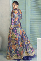 Back view of the purple palazzo suit, showing the flowing floral jacket and embroidered hem.