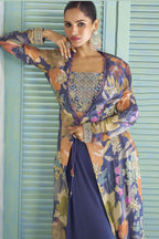 Detail shot of the purple palazzo suit's chinon silk floral print and thread embroidery.