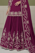 Burgundy kurta sets, waist-down view showing flared skirt with mirror and moti work embroidery.