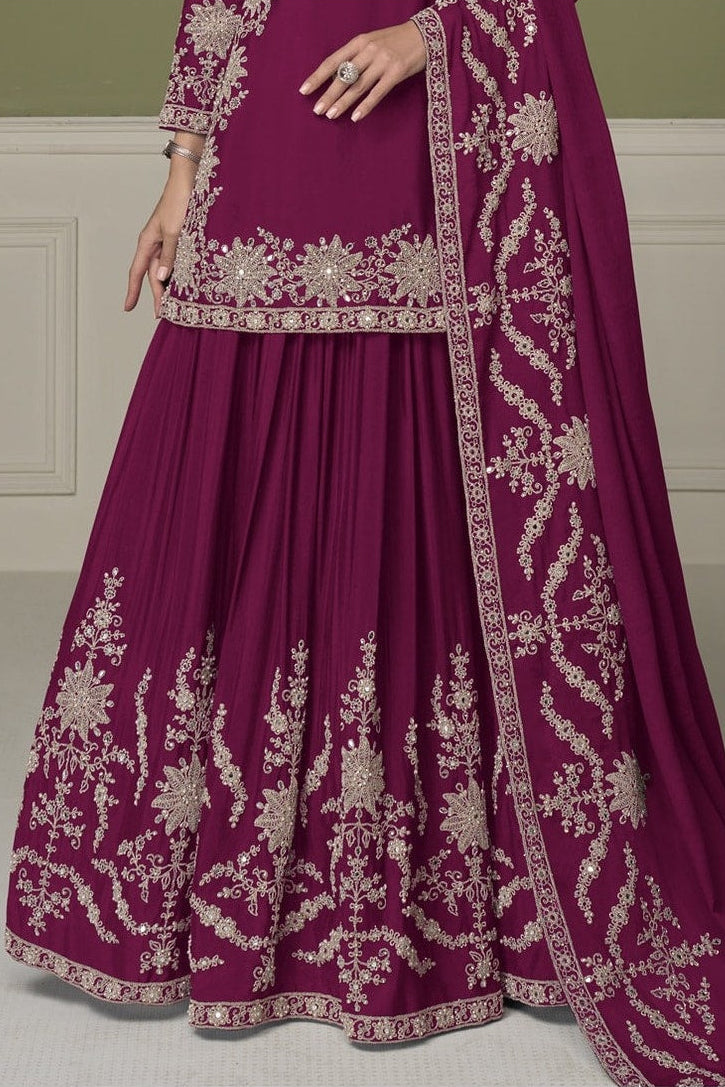 Burgundy kurta sets, waist-down view showing flared skirt with mirror and moti work embroidery.