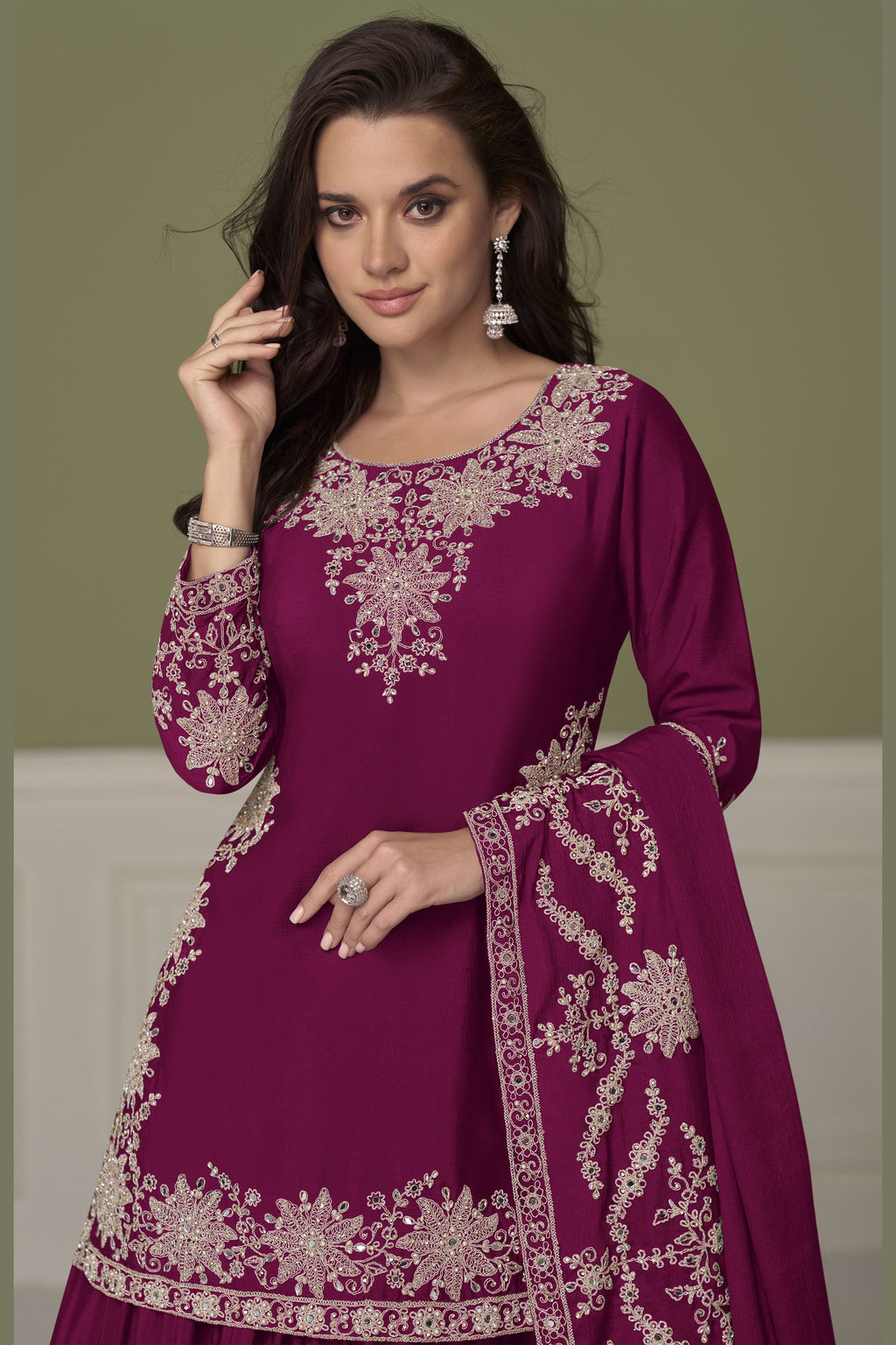 Close-up of burgundy indian kurta neckline, mirror work and moti embroidery detail on chinon silk.