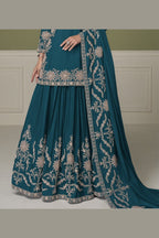 Close-up of dark teal kurta sets neckline, mirror work and moti embroidery on chinon silk.