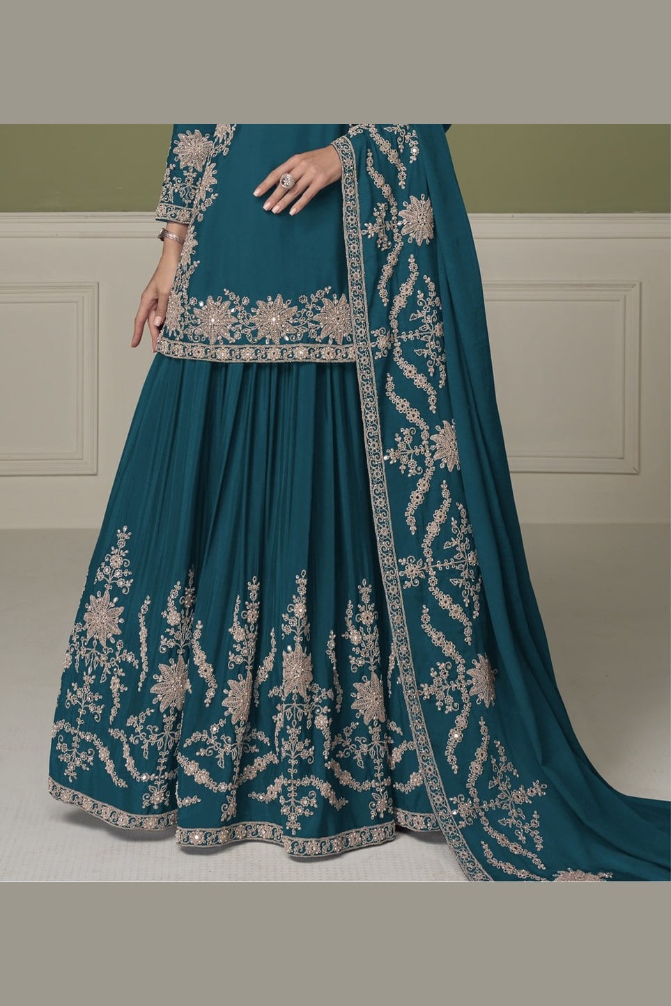 Close-up of dark teal kurta sets neckline, mirror work and moti embroidery on chinon silk.