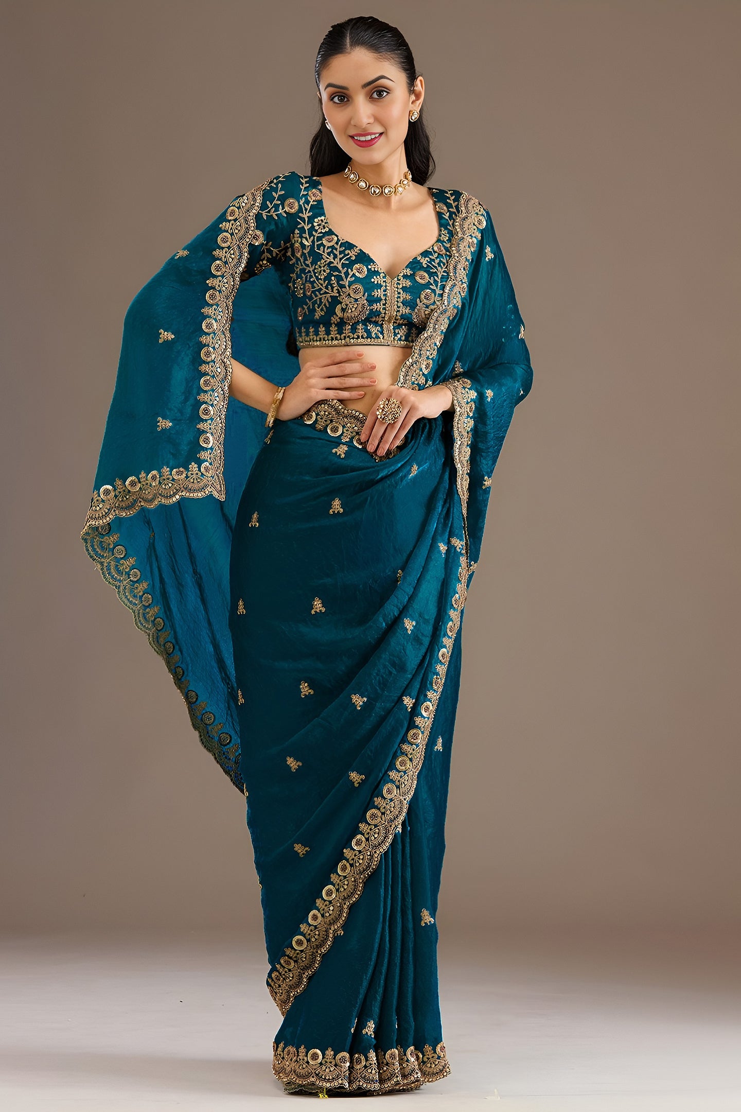 Teal Tissue Saree with Stitched Blouse featuring Sequin Zari and Pearl Work