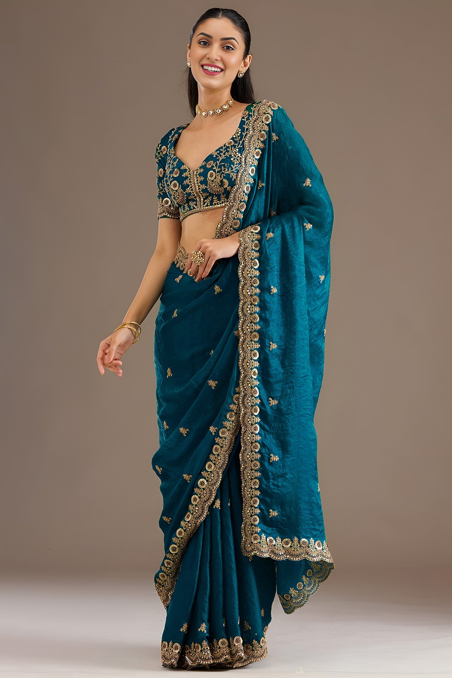 Teal Tissue Saree with Stitched Blouse featuring Sequin Zari and Pearl Work