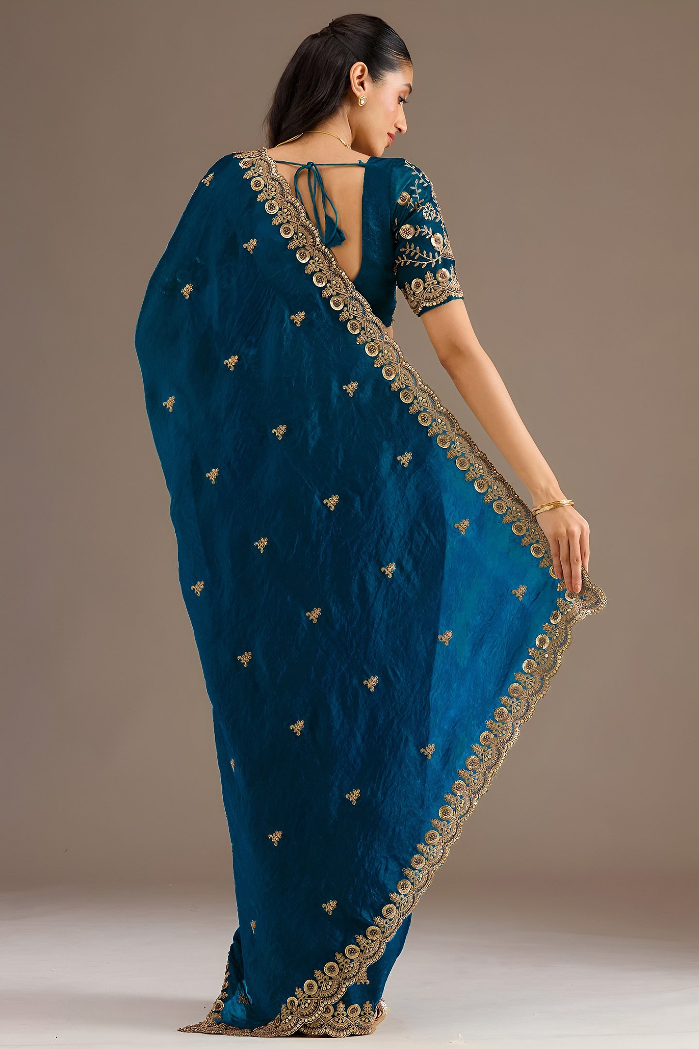 Teal Tissue Saree with Stitched Blouse featuring Sequin Zari and Pearl Work