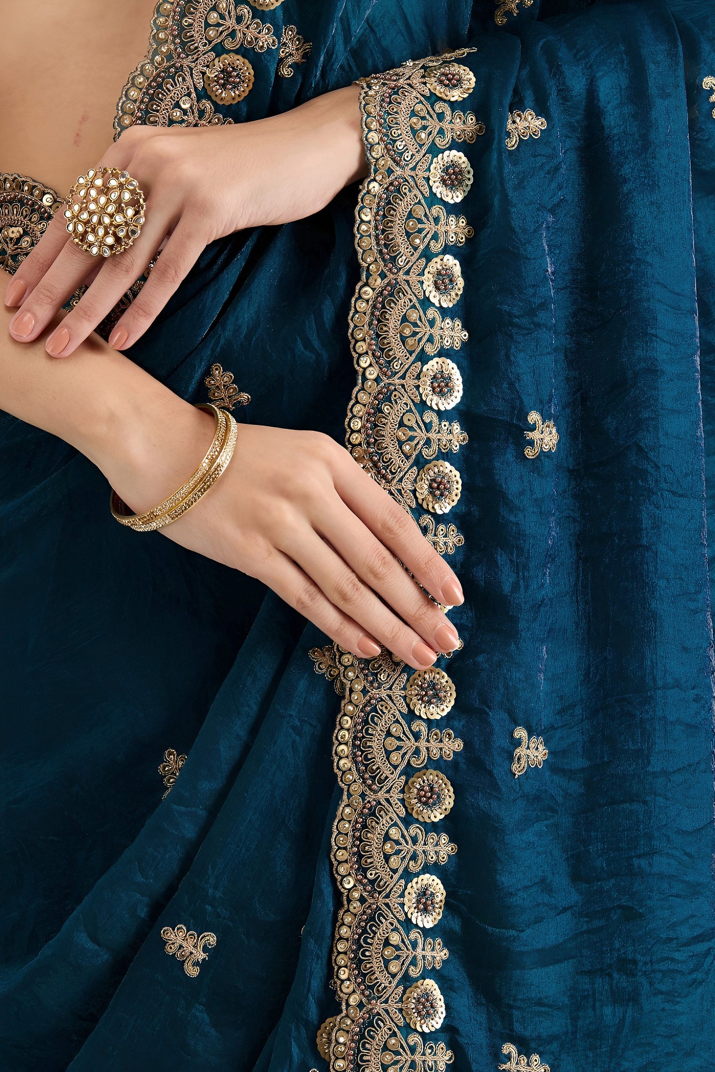 Teal Tissue Saree with Stitched Blouse featuring Sequin Zari and Pearl Work