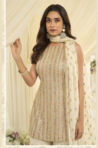 Close-up view of a cream gharara suit in georgette with Swarovski, Zarkan and embroidery work on the kameez neckline and bodice.